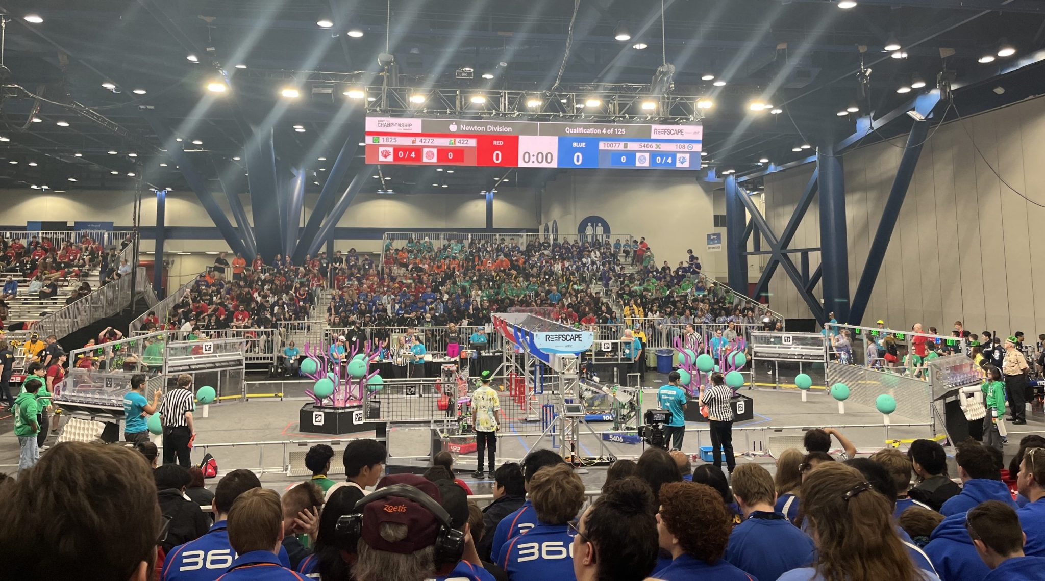 competition floor featuring competing students and their robots