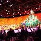 Wide shot image of entire stage performance of Disney's Candlelight processional featuring a mass choir and orchestra